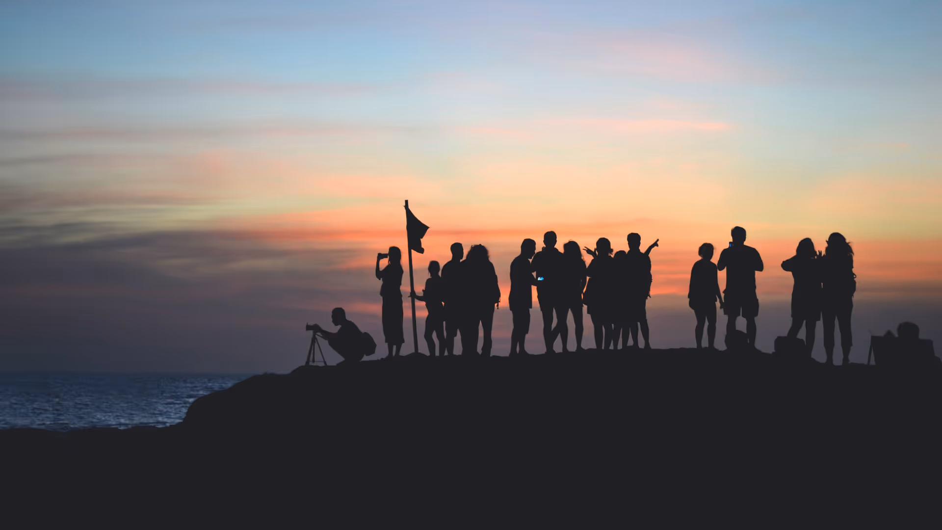 Silhouette of a group of photographers during sunset.